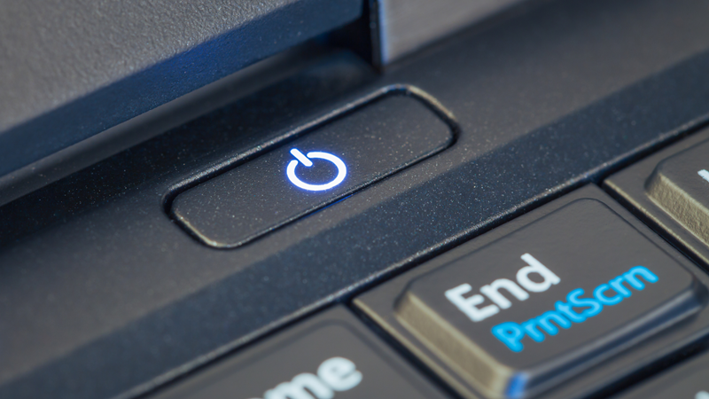 Close-up of a laptop keyboard with a power button and 'End PrintScan' key.