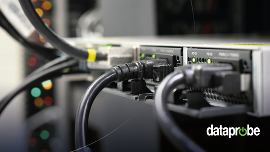 Close-up of black Ethernet cables plugged into a network switch or server rack, with a blurred server environment in the background and a 'dataprobe' watermark in the bottom right corner.